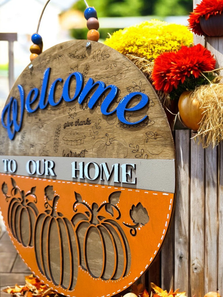 Welcome to Our Home Fall Sign – Pumpkin Door Hanger with Engraved Autumn Icons – Blue or Berry Color Options