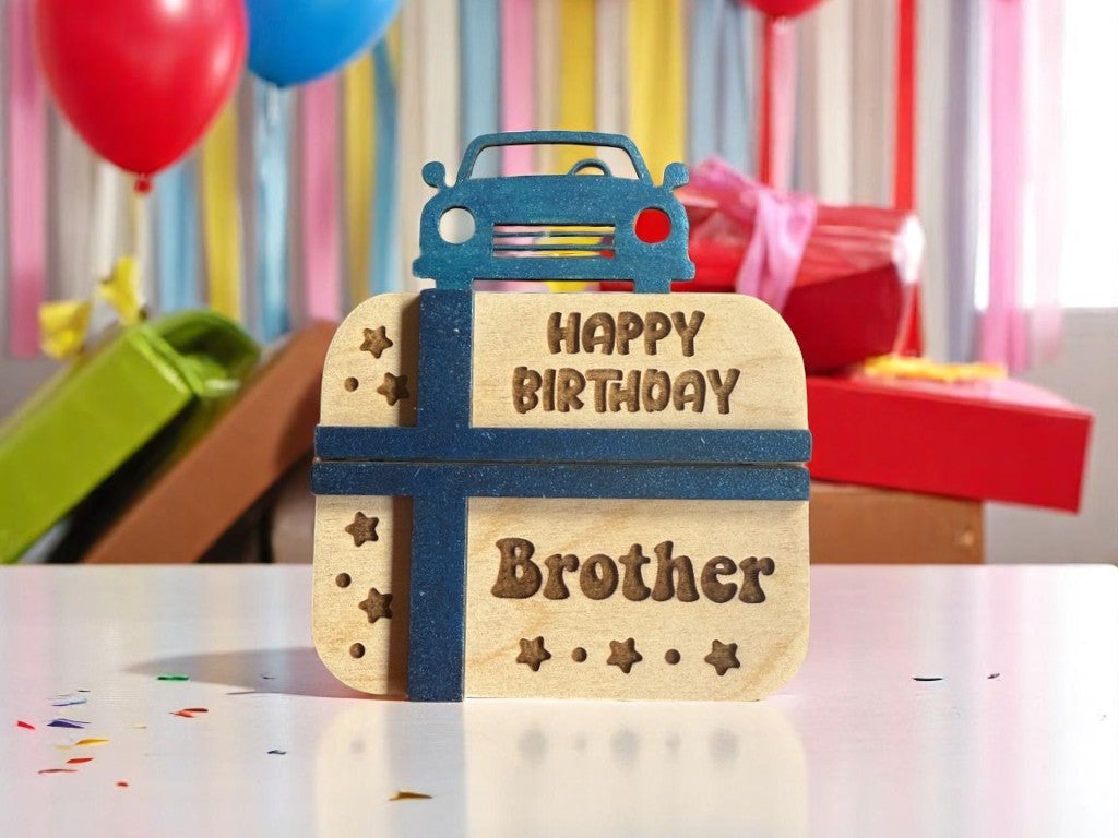 Handmade wooden birthday gift card holder for brother – present design with "Happy Birthday Brother" engraving, displayed on a party table with balloons and decorations