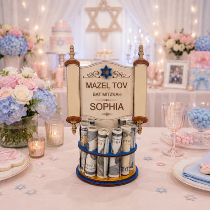 Premium handmade wood Torah scroll Bar Mitzvah money tree with detailed open scroll design, Star of David, and personalized text reading "Mazel Tov Bat Mitzvah Sophia," on a single-tiered blue base holding 13 rolled bills, styled on a pink Bat Mitzvah celebration table with blue hydrangeas and pink roses